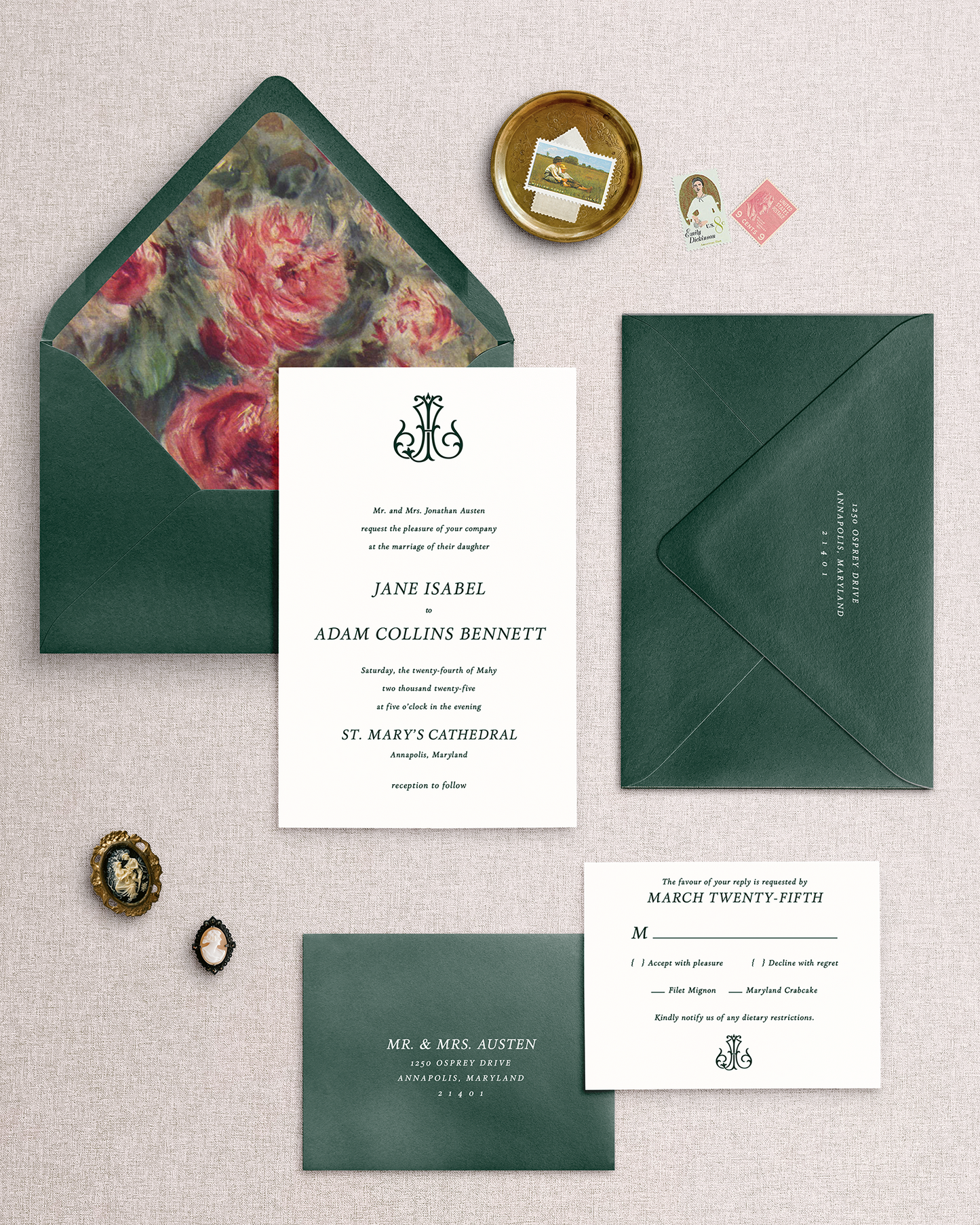 The Jane 4 piece wedding invitation set with green envelopes and floral design on a textured surface