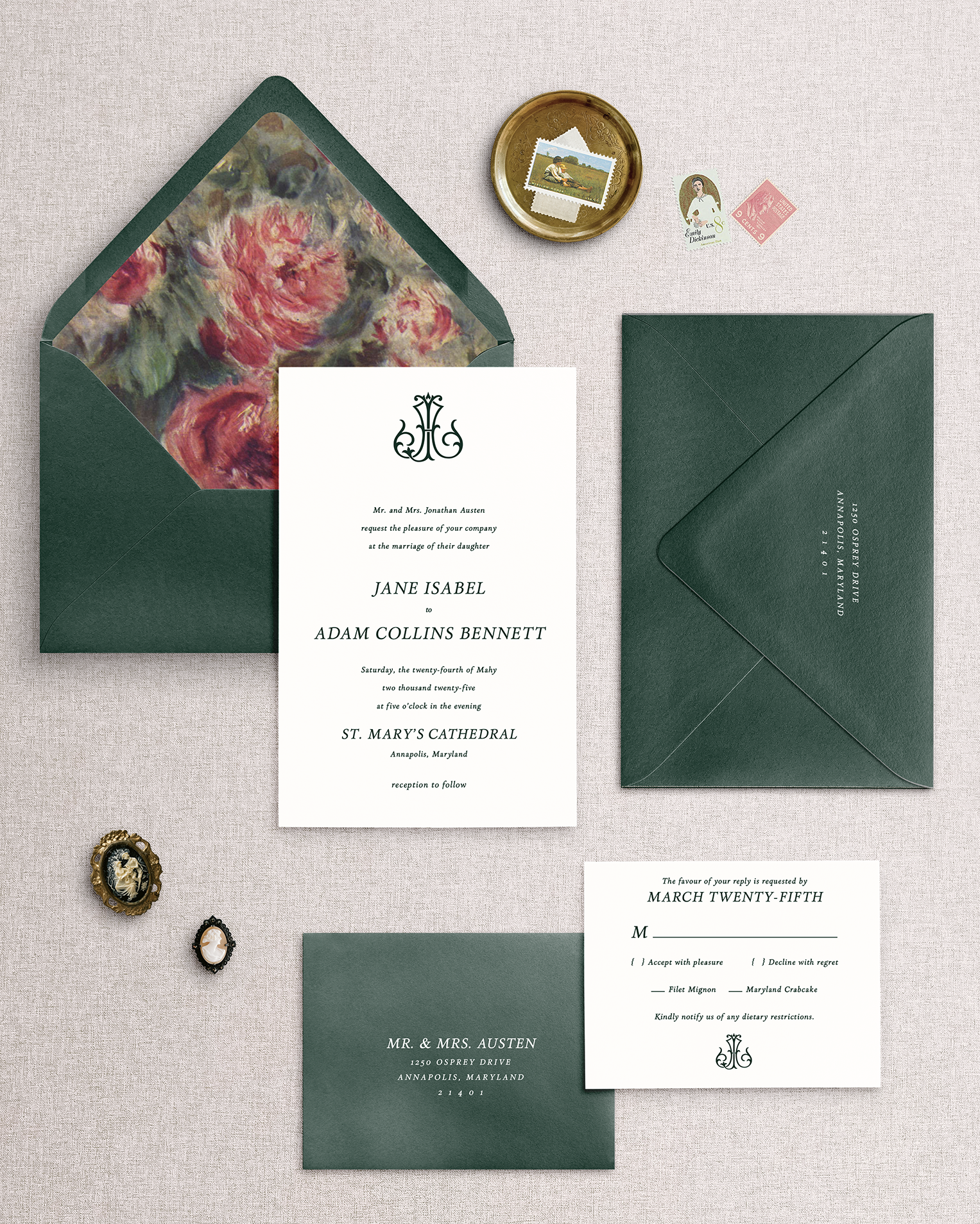 The Jane 4 piece wedding invitation set with green envelopes and floral design on a textured surface