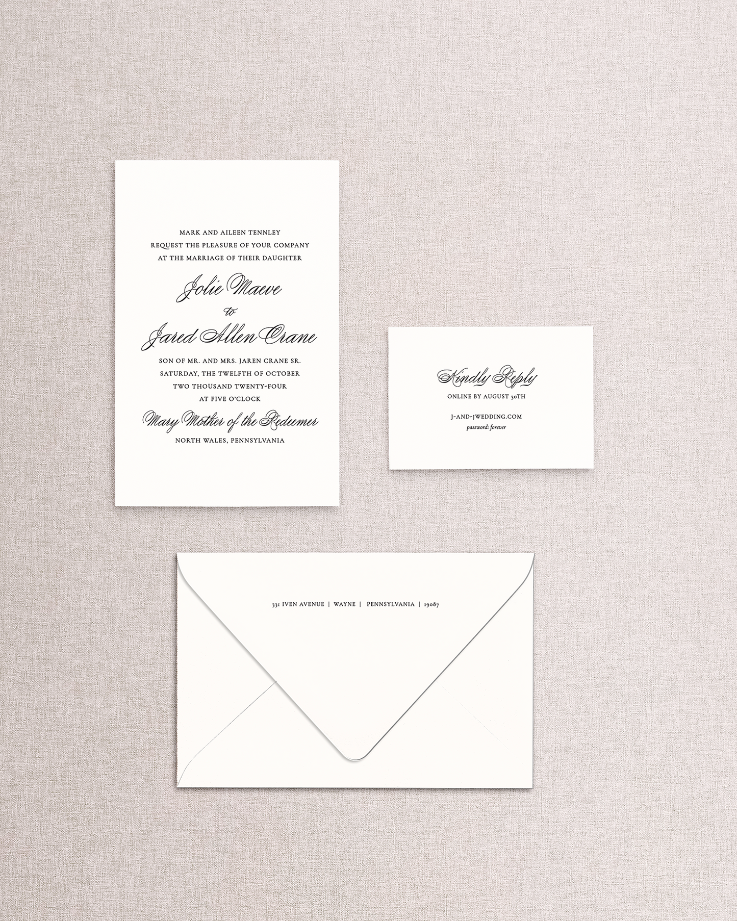 Wedding invitation set with envelope on a textured gray background