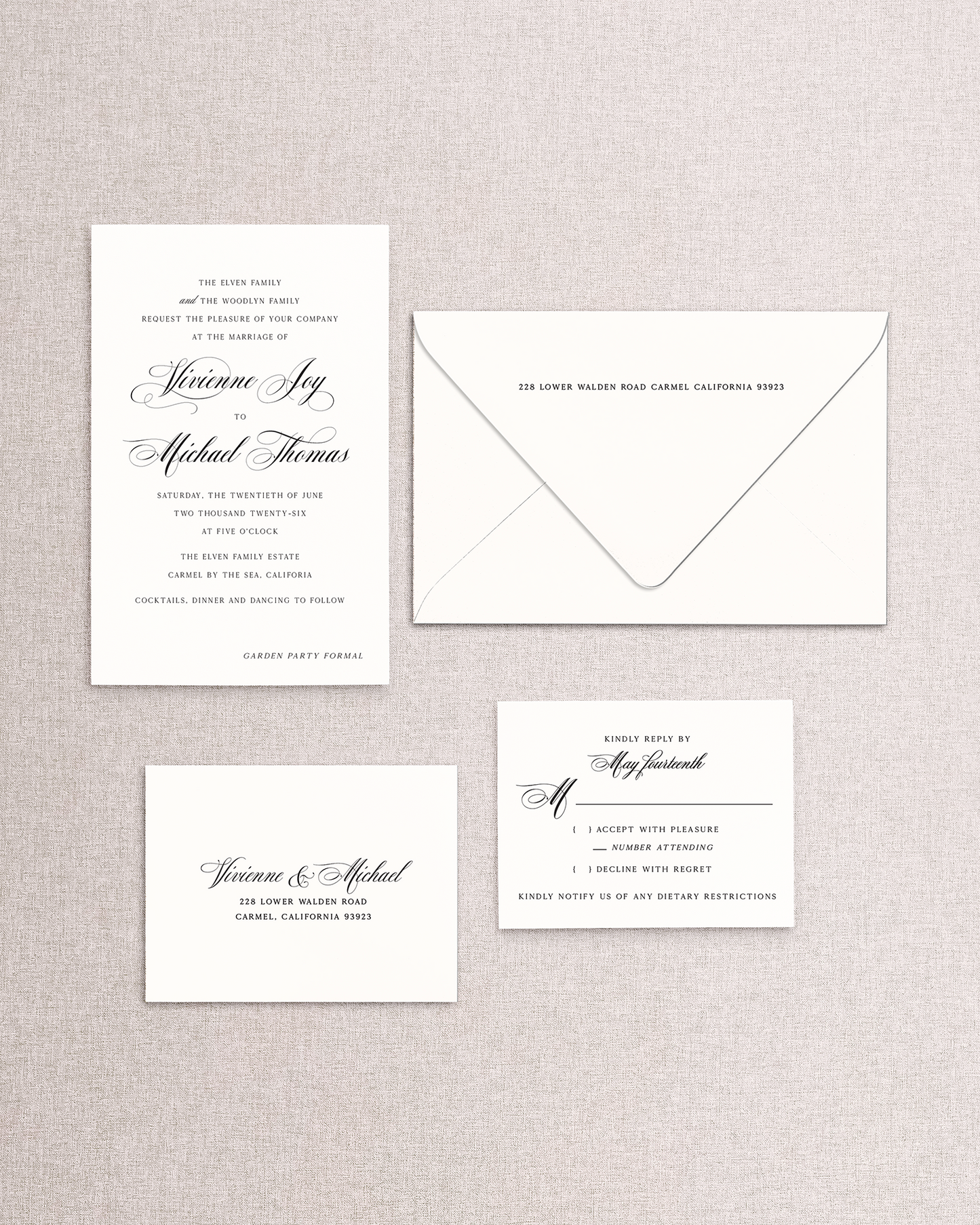 Set of formal wedding invitations with a matching envelope on a textured gray background