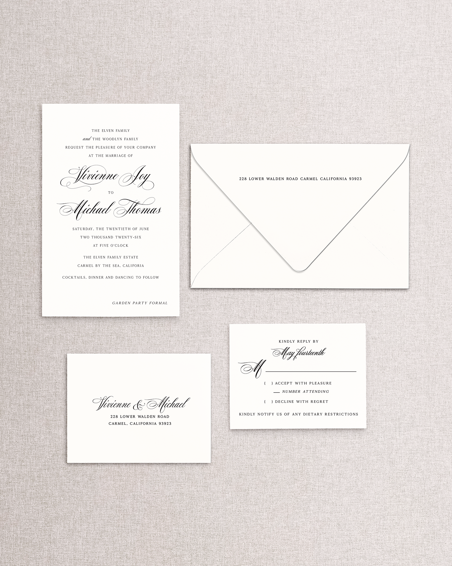 Set of formal wedding invitations with a matching envelope on a textured gray background