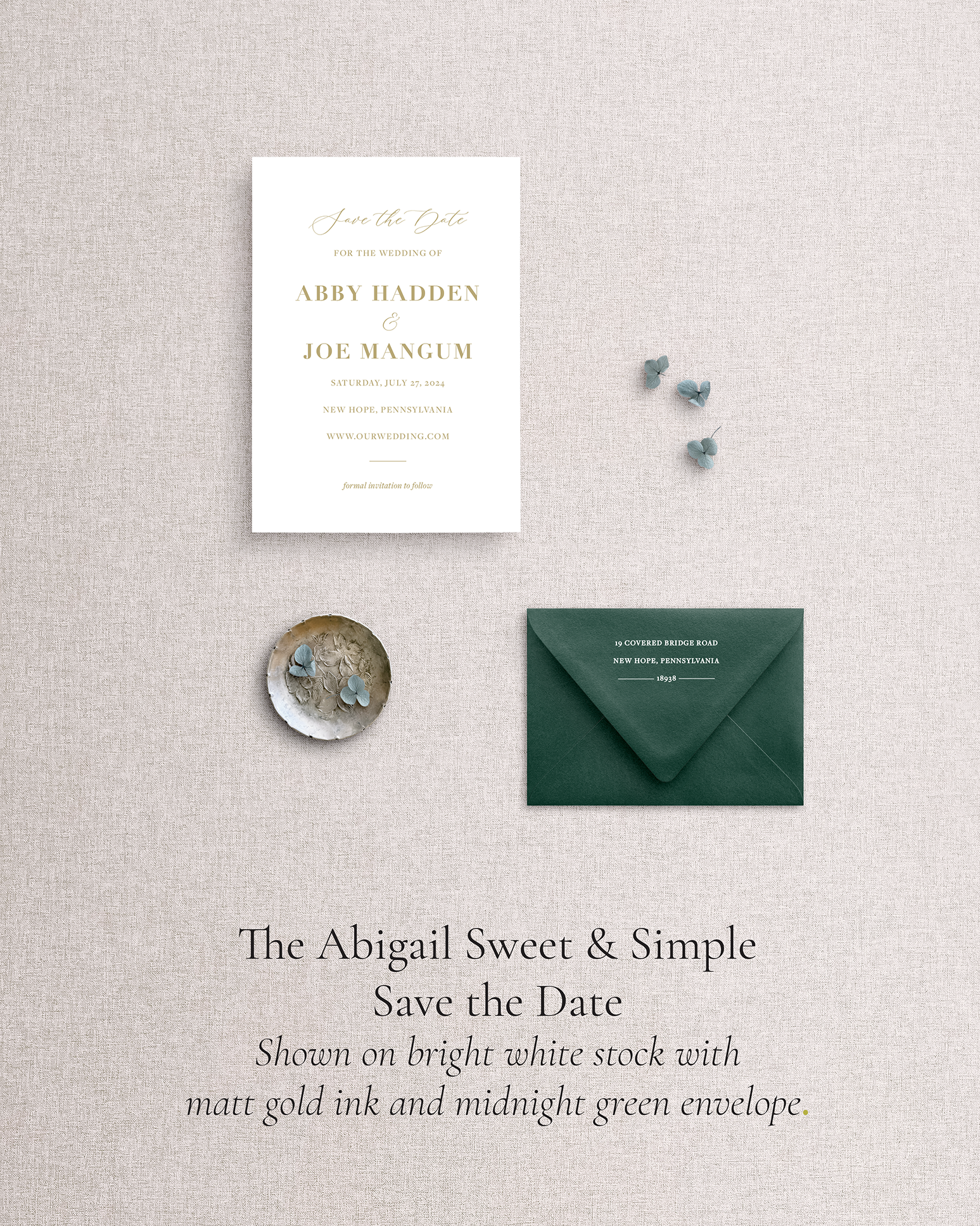 Wedding save the date card with dark green envelope on a textured gray background