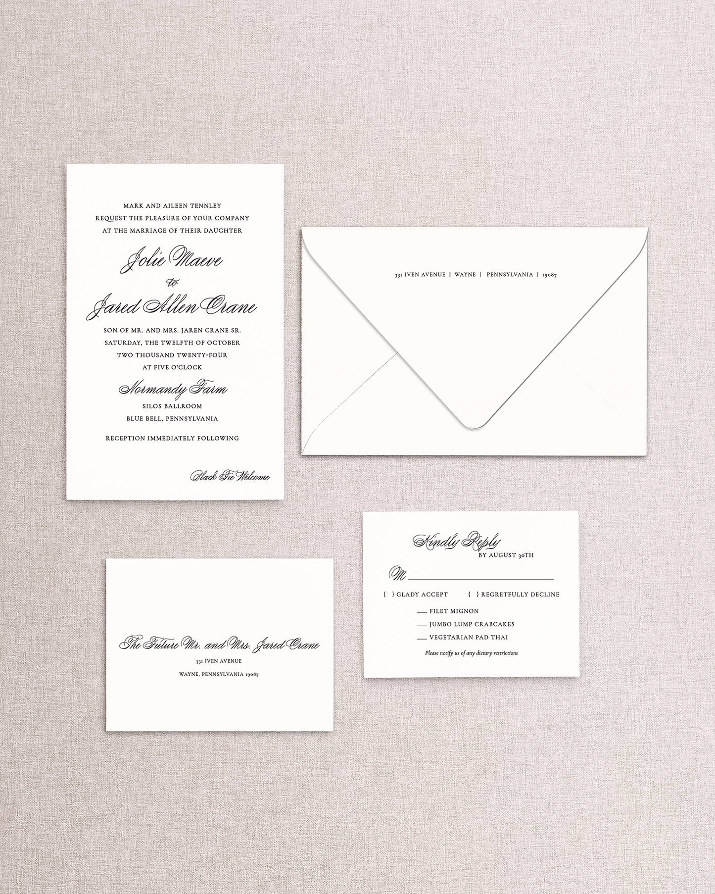 Set of wedding invitations and envelope on a textured gray background