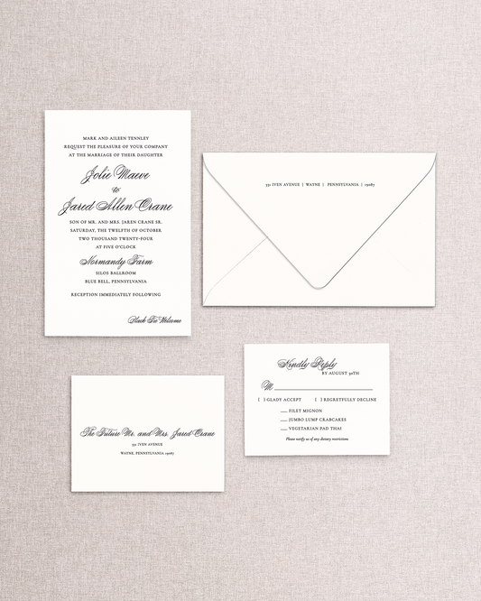 Set of wedding invitations and envelope on a textured gray background