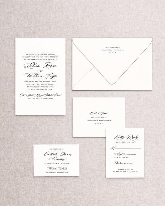 Set of formal wedding invitations and envelope on a textured gray background. Shown are the invitation and envelope, response card and envelope, and reception card from the Lillian design.
