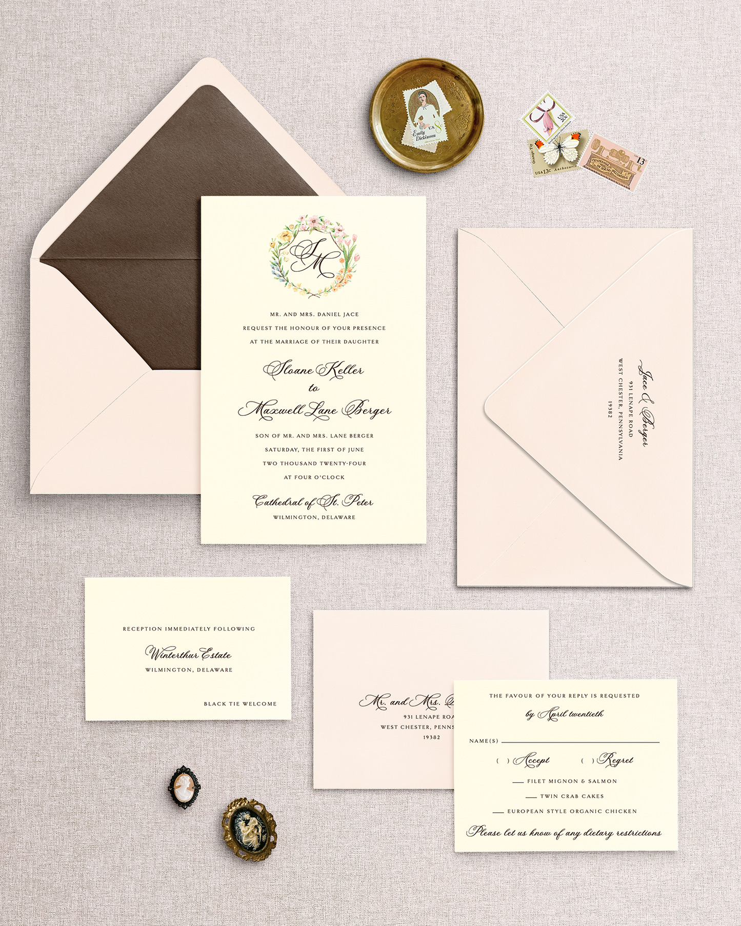 Collection of wedding invitations from the Sloane design with ivory cards and a blush envelope with a brown envelope liner a textured surface