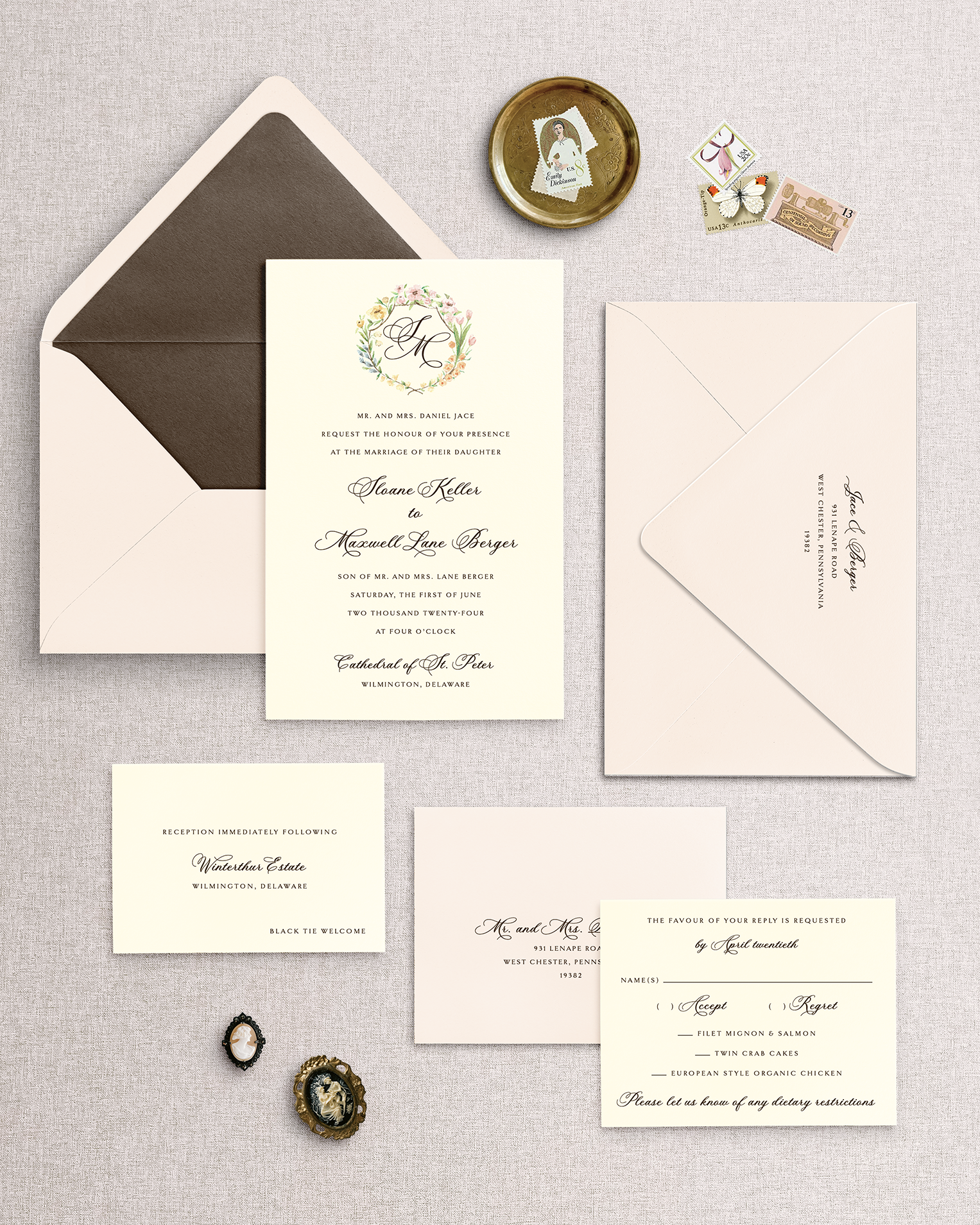 Collection of wedding invitations from the Sloane design with ivory cards and a blush envelope with a brown envelope liner a textured surface